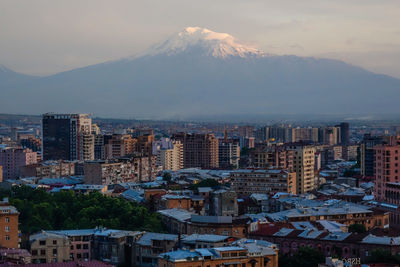 Aerial view of townscape against sky during sunset