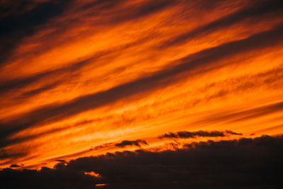 Low angle view of dramatic sky during sunset