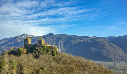 Sunny scenery around the leonburg near lana in south tyrol at winter time