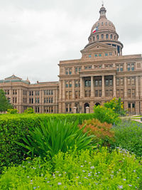 View of buildings against cloudy sky