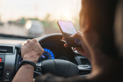 Midsection of woman using mobile phone