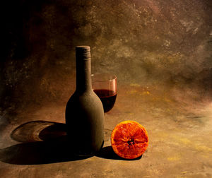 Close-up of beer bottle against black background