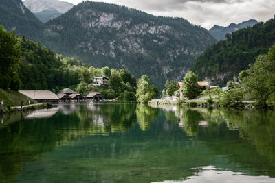 Scenic view of lake with mountain range in background