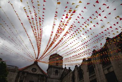 Low angle view of multi colored temple against sky