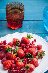 High angle view of strawberries in bowl on table