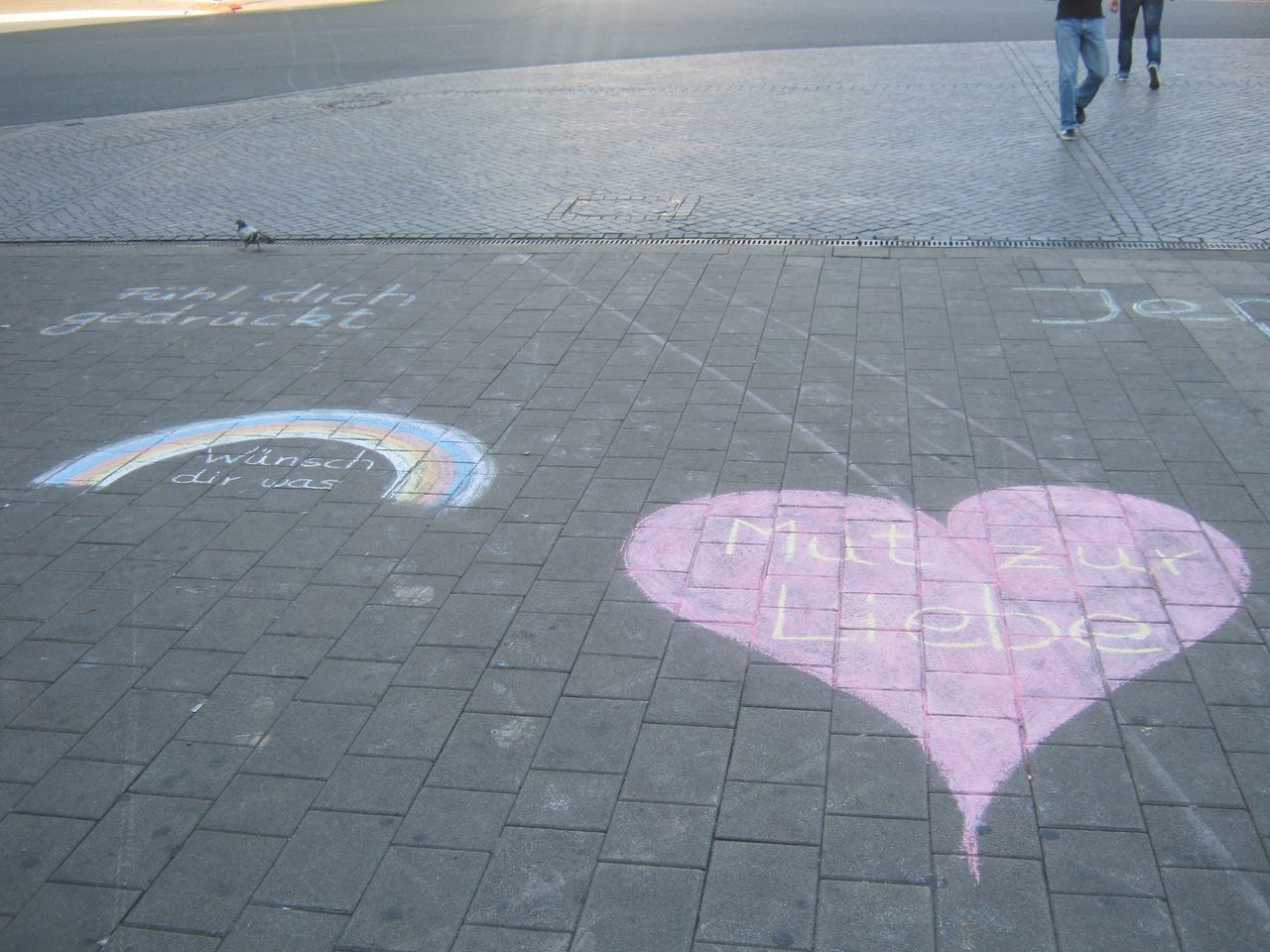 HIGH ANGLE VIEW OF COUPLE WALKING ON ROAD