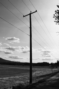 Electricity pylon on field