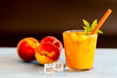 Close-up of orange juice on table