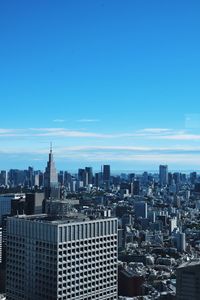 Cityscape against clear blue sky