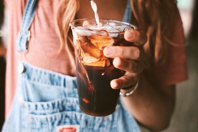 Woman making iced coffee