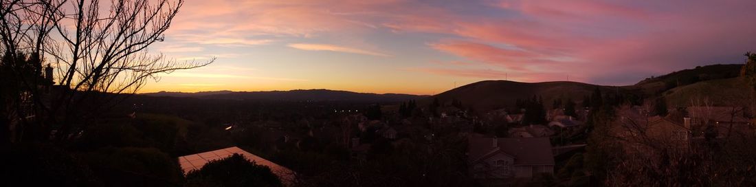 Panoramic view of townscape against sky during sunset