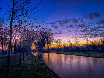 Scenic view of lake against sky during sunset