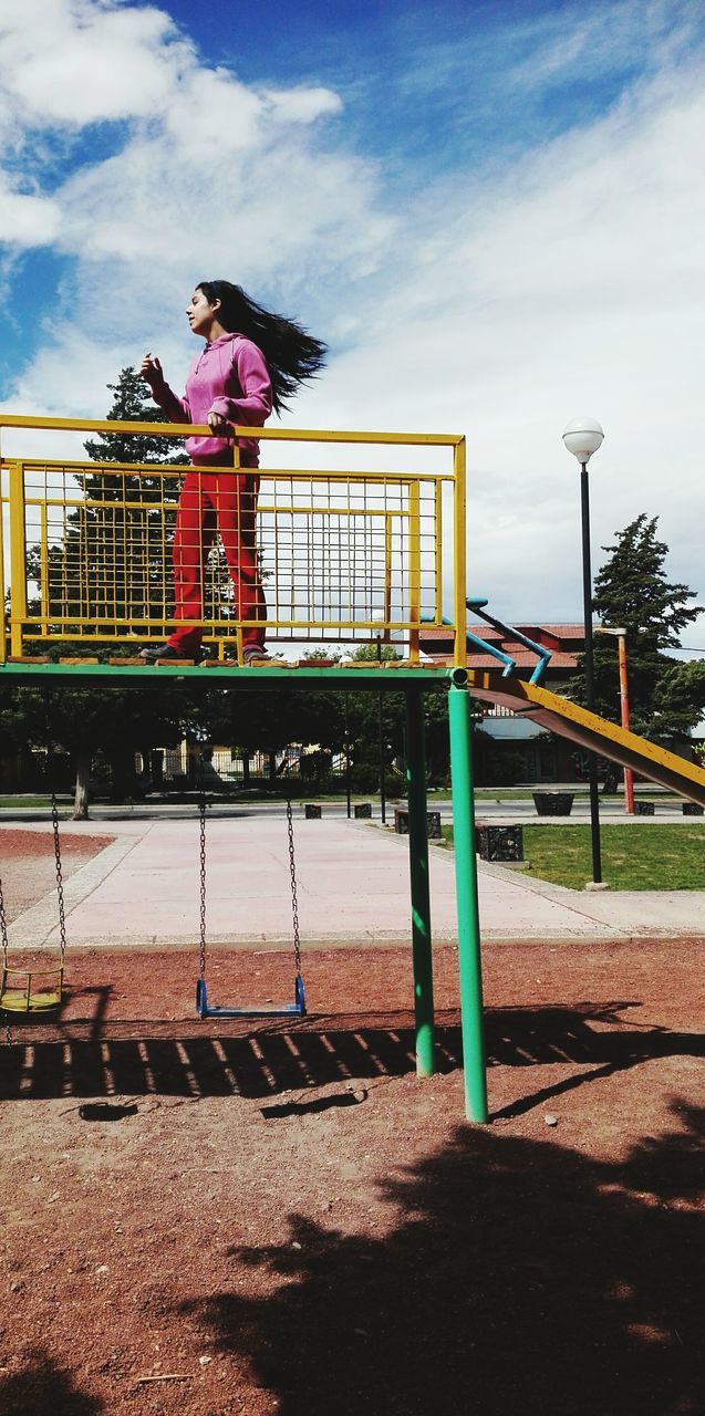 MAN STANDING ON STEPS IN CITY