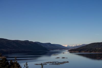 Scenic view of mountains against clear blue sky