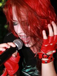 Close-up of young woman singing