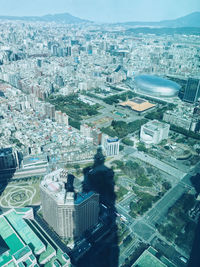 High angle view of crowd and buildings in city