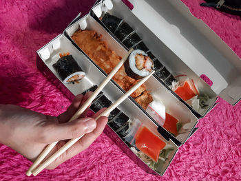 High angle view of person having food on table