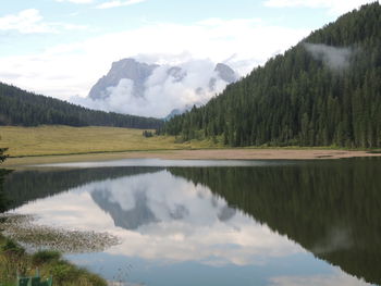 Scenic view of lake and mountains against sky