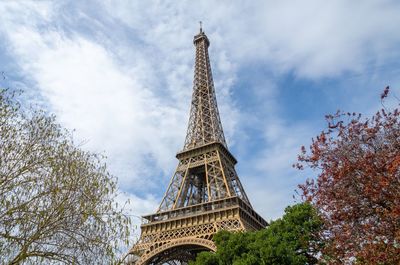 Low angle view of tower against cloudy sky