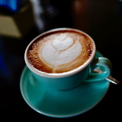 Close-up of cappuccino on table