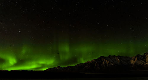 Low angle view of mountain against sky at night