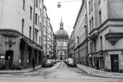 Road along buildings in city