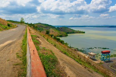 Panoramic view of road by sea against sky