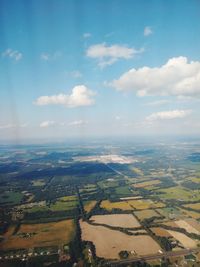 Aerial view of agricultural field against sky