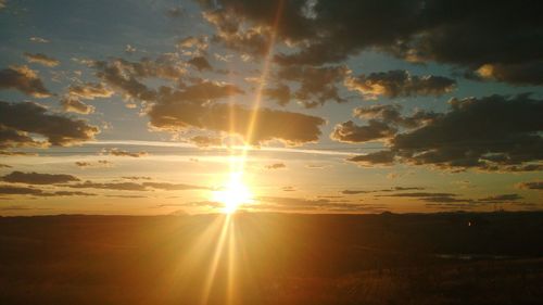 Scenic view of silhouette landscape against sky during sunset