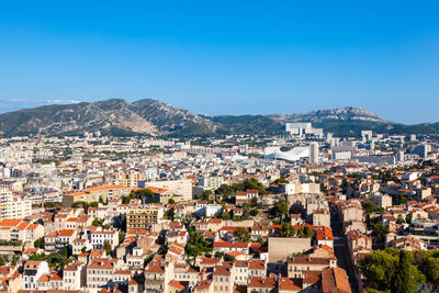 Aerial view of townscape against sky