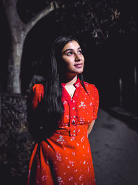 Young woman looking away outdoors