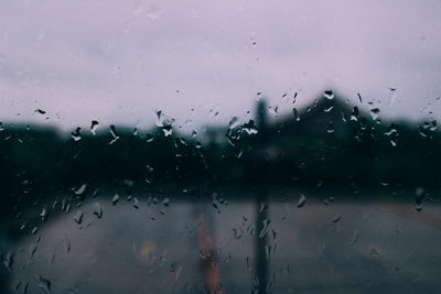 Raindrops on glass window during rainy season