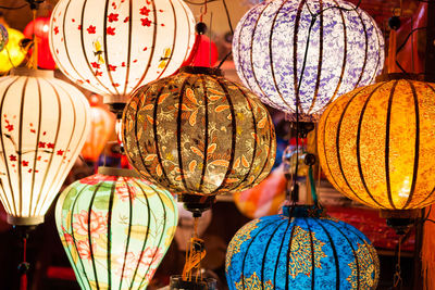 Illuminated lanterns hanging at night