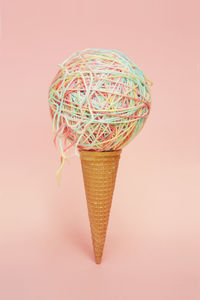 Close-up of ice cream against colored background