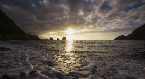 Scenic view of sea against sky during sunset