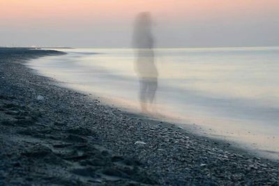 Scenic view of sea at sunset