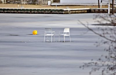 Lost chairs on frozen lake