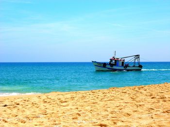 Scenic view of sea against blue sky