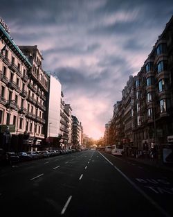 City street against cloudy sky