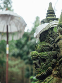 Close-up of statue against sky