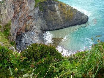 High angle view of rocks by sea