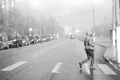 Woman walking on city street