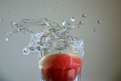 Close-up of glass of water splashing