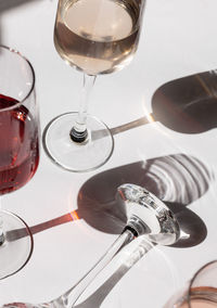 Close-up of wine glasses on table