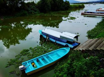 High angle view of boats moored on river