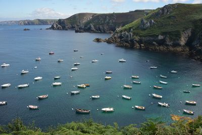 Scenic view of moored boats on sea