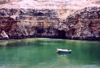 Scenic view of rock formation in sea