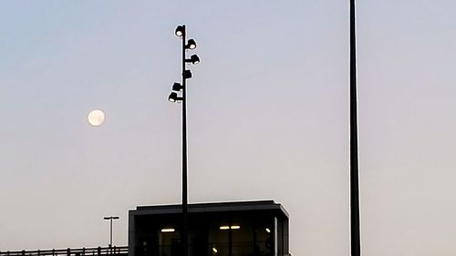 Low angle view of floodlight against clear sky