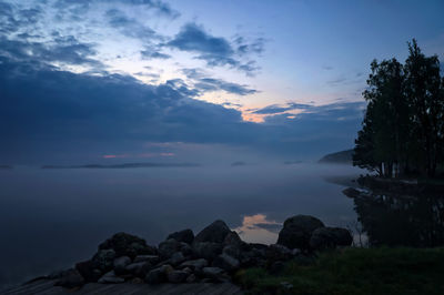 Scenic view of rocks against sky during sunset