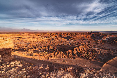 Scenic view of desert against sky during sunset